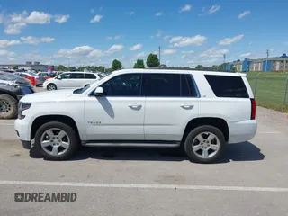 2015 Chevrolet Tahoe LT with VIN 1GNSKBKC8FR194164, listed as a IAAI auction lot 42315215 with 211,797 mi miles and . Bid and sale history available at DreamBid. Image 14.