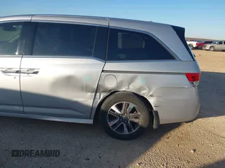 2014 Honda Odyssey Touring with VIN 5FNRL5H97EB094353, listed as a IAAI auction lot 41701712 with 141,228 mi miles and . Bid and sale history available at DreamBid. Image 18.