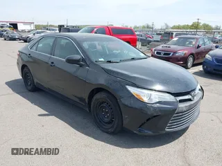 2015 Toyota Camry LE with VIN 4T1BD1FKXFU164963, listed as a IAAI auction lot 42132724 with 141,089 mi miles and . Bid and sale history available at DreamBid. Image 1.