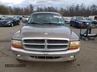 2001 Dodge Dakota z VIN 1B7GG2AX11S108005, wystawiony jako Copart lot #87124934 z przebiegiem 248 482 mil mil oraz Czysty tytuł • Clean title. Historia ofert i sprzedaży dostępna na DreamBid. Obrazek 5.