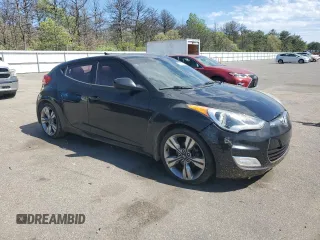 2013 Hyundai Veloster w/Gray Int z VIN KMHTC6ADXDU092253, wystawiony jako Copart lot #57708055 z przebiegiem 141 904 mil mil oraz Tytuł czysty. Historia ofert i sprzedaży dostępna na DreamBid. Obrazek 4.