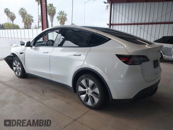 2023 Tesla Model Y Long Range z VIN 7SAYGDEE2PF834036, wystawiony jako IAAI lot #41933120 z przebiegiem 27 872 mil mil oraz . Historia ofert i sprzedaży dostępna na DreamBid. Obrazek 3.