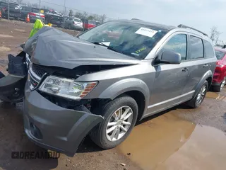 2013 Dodge Journey SXT with VIN 3C4PDCBG6DT506486, listed as a IAAI auction lot 41877271 with 196,597 mi miles and . Bid and sale history available at carsss.com. Image 2.