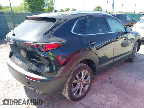 2024 Mazda CX-30 S Premium with VIN 3MVDMBDM4RM651543, listed as a IAAI auction lot 41993345 with 25,675 mi miles and . Bid and sale history available at DreamBid. Image 4.