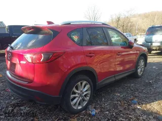 2014 Mazda CX-5 Grand Touring with VIN JM3KE2DY1E0380423, listed as a IAAI auction lot 41854206 with 129,763 mi miles. Bid and sale history available at carsss.com. Image 4.