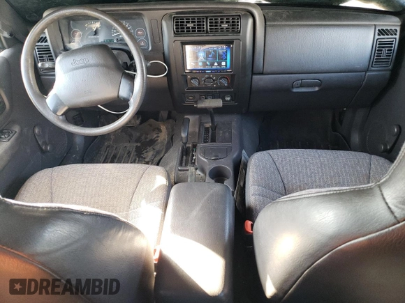 1999 Jeep Cherokee SE with VIN 1J4FF28S3XL551875, listed as a Copart auction lot 43057555 with 226,794 mi miles and Salvage title. Bid and sale history available at DreamBid. Image 8.
