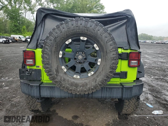 2012 Jeep Wrangler Sport with VIN 1C4AJWAG2CL233722, listed as a Copart auction lot 61125095 with 49,864 mi miles and Salvage title. Bid and sale history available at DreamBid. Image 6.