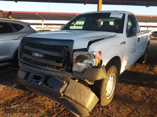 2014 Ford F-150 XL with VIN 1FTMF1CM4EKE98669, listed as a IAAI auction lot 41310314 with 133,239 mi miles. Bid and sale history available at carsss.com. Image 6.