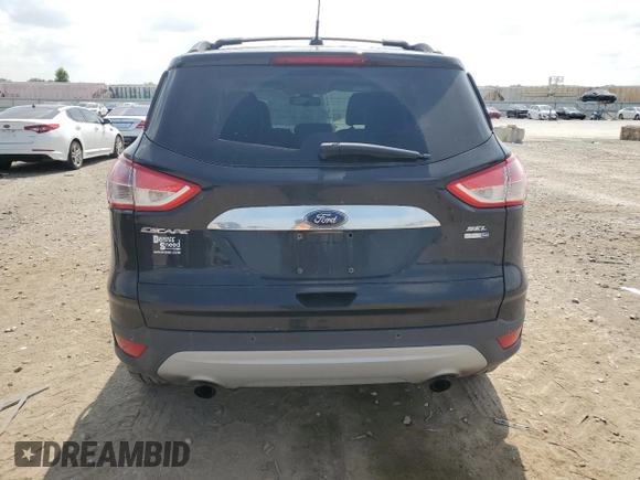 2013 Ford Escape SEL z VIN 1FMCU9HXXDUD65870, wystawiony jako Copart lot #60985855 z przebiegiem 139 440 mil mil oraz Szkoda całkowita • Salvage title. Historia ofert i sprzedaży dostępna na DreamBid. Obrazek 6.