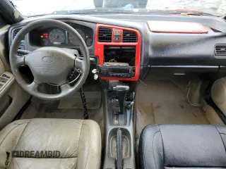 1999 Infiniti G20 z VIN JNKCP11A8XT019442, wystawiony jako Copart lot #66429804 z przebiegiem 209 367 mil mil oraz Szkody całkowita. Historia ofert i sprzedaży dostępna na DreamBid. Obrazek 8.