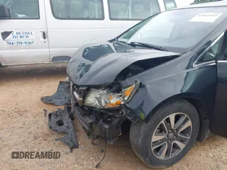 2015 Honda Odyssey Touring Elite with VIN 5FNRL5H90FB065004, listed as a IAAI auction lot 42461597 with 317,523 mi miles and . Bid and sale history available at DreamBid. Image 6.