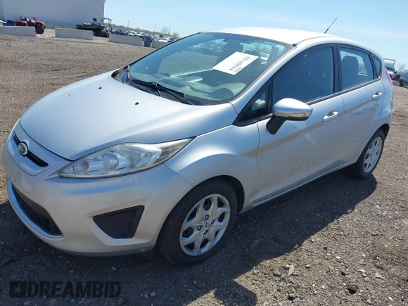 2013 Ford Fiesta SE with VIN 3FADP4EJ9DM157685, listed as a IAAI auction lot 42145511 with 101,331 mi miles. Bid and sale history available at carsss.com. Image 2.