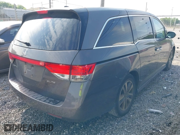 2014 Honda Odyssey Touring with VIN 5FNRL5H99EB111685, listed as a IAAI auction lot 42141227 with 183,484 mi miles and . Bid and sale history available at DreamBid. Image 4.