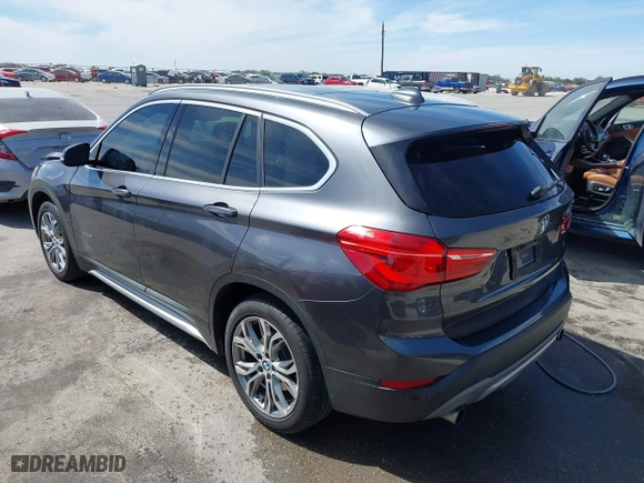 2017 BMW X1 xDrive28i with VIN WBXHT3Z33H4A65198, listed as a IAAI auction lot 41798503 with 88,951 mi miles. Bid and sale history available at carsss.com. Image 3.