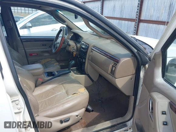 2002 Jeep Grand Cherokee Limited z VIN 1J4GX58N62C195783, wystawiony jako IAAI lot #42745397 z przebiegiem 242 502 mil mil oraz . Historia ofert i sprzedaży dostępna na DreamBid. Obrazek 5.