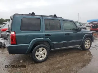 2006 Jeep Commander with VIN 1J8HH48NX6C125803, listed as a Copart auction lot 71247304 with 214,297 mi miles and Salvage Title. Bid and sale history available at carsss.com. Image 3.