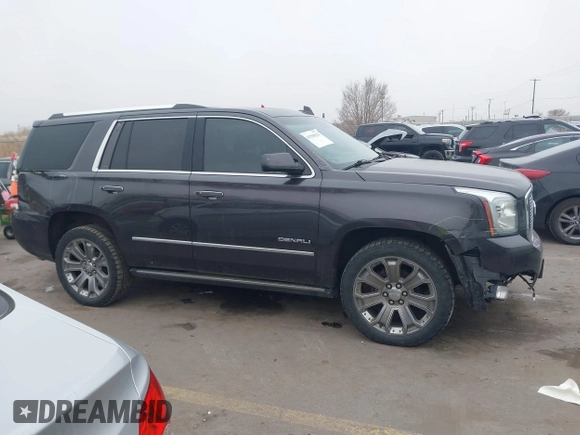 2015 GMC Yukon Denali with VIN 1GKS2CKJ2FR705806, listed as a IAAI auction lot 41568322 with 171,011 mi miles. Bid and sale history available at carsss.com. Image 13.