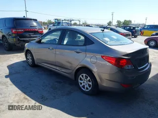 2014 Hyundai Accent GLS z VIN KMHCT4AE9EU671748, wystawiony jako IAAI lot #42356469 z przebiegiem 179 390 mil mil oraz . Historia ofert i sprzedaży dostępna na DreamBid. Obrazek 3.