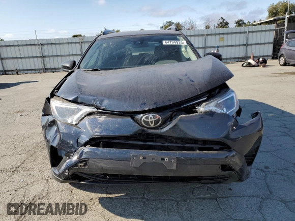 2017 Toyota RAV4 LE with VIN JTMBFREVXHJ146587, listed as a Copart auction lot 64794935 with 92,192 mi miles and Salvage title. Bid and sale history available at DreamBid. Image 5.