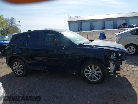 2014 Mazda CX-5 Touring z VIN JM3KE4CY4E0328880, wystawiony jako IAAI lot #42112302 z przebiegiem 185 228 mil mil oraz . Historia ofert i sprzedaży dostępna na DreamBid. Obrazek 14.