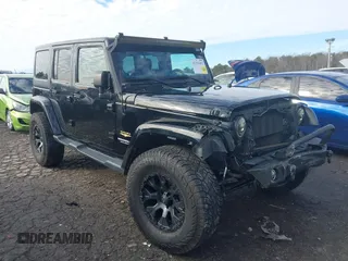 2014 Jeep Wrangler Unlimited Sahara z VIN 1C4BJWEGXEL263830, wystawiony jako IAAI lot #41311453 z przebiegiem 82 177 mil mil oraz . Historia ofert i sprzedaży dostępna na DreamBid. Obrazek 1.