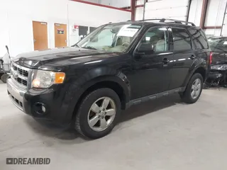 2011 Ford Escape Limited with VIN 1FMCU0EG0BKB30015, listed as a IAAI auction lot 41987953 with 203,057 mi miles. Bid and sale history available at carsss.com. Image 2.