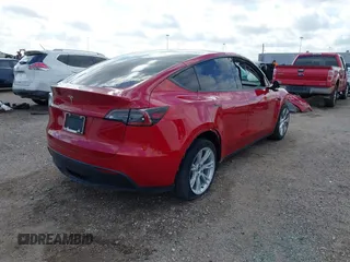 2020 Tesla Model Y Long Range with VIN 5YJYGDEE9LF009957, listed as a IAAI auction lot 41780248 with 31,053 mi miles and . Bid and sale history available at DreamBid. Image 4.