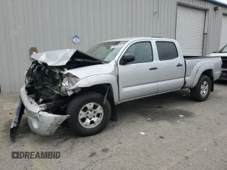 2010 Toyota Tacoma PreRunner with VIN 3TMKU4HN4AM025390, listed as a Copart auction lot 50242825 with 450,676 mi miles and Salvage title. Bid and sale history available at DreamBid. Image 1.