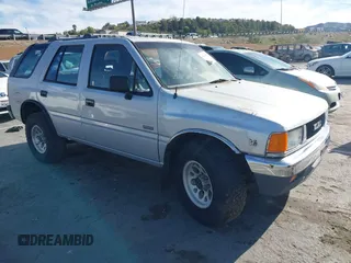 1992 Isuzu Rodeo z VIN 4S2CY58Z2N4301329, wystawiony jako IAAI lot #41830825 z przebiegiem 125 546 mil mil oraz . Historia ofert i sprzedaży dostępna na DreamBid. Obrazek 1.