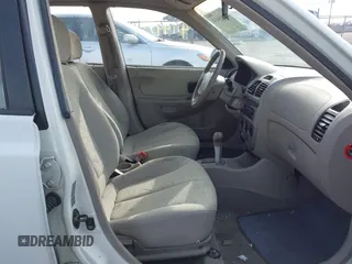 2004 Hyundai Accent GL with VIN KMHCG45C64U539526, listed as a IAAI auction lot 41199434 with 81,442 mi miles. Bid and sale history available at carsss.com. Image 5.