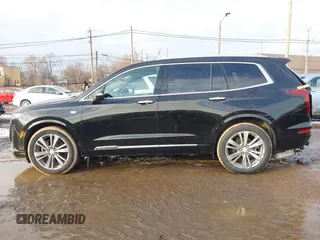 2025 Cadillac XT6 FWD Premium Luxury with VIN 1GYKPCRS6SZ104902, listed as a IAAI auction lot 41565224 with 4,735 mi miles. Bid and sale history available at carsss.com. Image 14.
