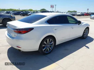 2021 Mazda 6 Touring with VIN JM1GL1VM4M1618686, listed as a IAAI auction lot 42079730 with 55,539 mi miles and . Bid and sale history available at DreamBid. Image 4.