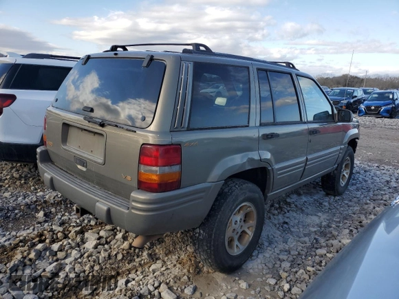 1997 Jeep Grand Cherokee Limited with VIN 1J4GZ78Y4VC567237, listed as a Copart auction lot 49059105 with 177,478 mi miles and Salvage Title. Bid and sale history available at carsss.com. Image 3.
