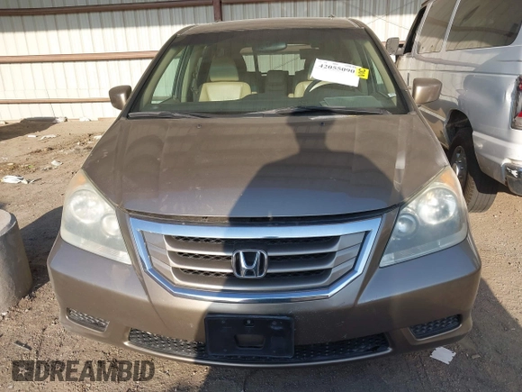 2010 Honda Odyssey EX-L with VIN 5FNRL3H79AB048049, listed as a IAAI auction lot 42055090 with 142,736 mi miles. Bid and sale history available at carsss.com. Image 12.