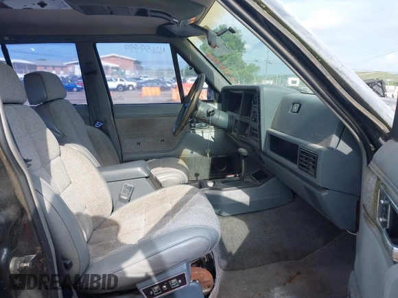 1991 Jeep Cherokee z VIN 1J4FJ58S6ML572036, wystawiony jako IAAI lot #42659999 z przebiegiem 200 845 mil mil oraz . Historia ofert i sprzedaży dostępna na DreamBid. Obrazek 5.