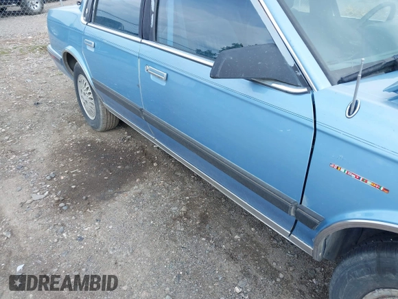 1991 Oldsmobile Cutlass Ciera z VIN 1G3AM54N3M6309525, wystawiony jako IAAI lot #42261904 z przebiegiem 121 774 mil mil oraz . Historia ofert i sprzedaży dostępna na DreamBid. Obrazek 16.