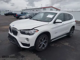 2018 BMW X1 sDrive28i with VIN WBXHU7C32J5H44246, listed as a IAAI auction lot 41477050 with 69,858 mi miles. Bid and sale history available at carsss.com. Image 2.