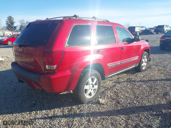 2010 Jeep Grand Cherokee Laredo with VIN 1J4PR4GK2AC135011, listed as a IAAI auction lot 41589996 with 111,536 mi miles. Bid and sale history available at carsss.com. Image 4.