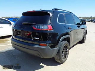 2019 Jeep Cherokee Latitude Plus with VIN 1C4PJLLBXKD176124, listed as a IAAI auction lot 41851150 with 90,101 mi miles. Bid and sale history available at carsss.com. Image 4.
