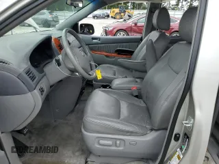 2010 Toyota Sienna XLE with VIN 5TDYK4CC1AS322395, listed as a Copart auction lot 60520215 with 148,725 mi miles and Salvage title. Bid and sale history available at DreamBid. Image 7.