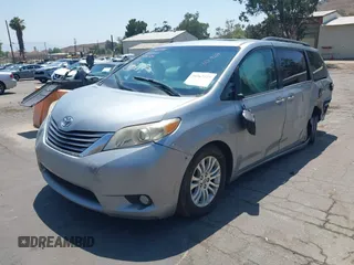 2015 Toyota Sienna XLE with VIN 5TDYK3DC0FS589947, listed as a IAAI auction lot 36567379 with 130,969 mi miles and . Bid and sale history available at DreamBid. Image 2.