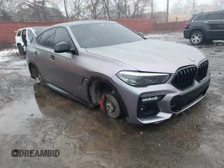 2021 BMW X6 xDrive40i with VIN 5UXCY6C07M9G44005, listed as a IAAI auction lot 41428636 with 65,670 mi miles. Bid and sale history available at carsss.com. Image 1.