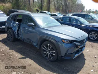 2023 Mazda CX-50 2.5 Turbo with VIN 7MMVABXY9PN143049, listed as a IAAI auction lot 42070819 with 12,469 mi miles and . Bid and sale history available at DreamBid. Image 1.