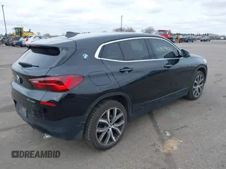 2020 BMW X2 xDrive28i with VIN WBXYJ1C02L5R71755, listed as a IAAI auction lot 41957012 with 69,997 mi miles. Bid and sale history available at carsss.com. Image 4.