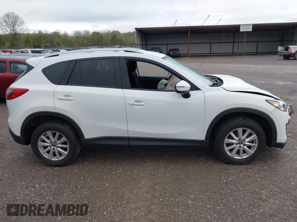 2016 Mazda CX-5 Touring with VIN JM3KE4CY0G0903723, listed as a IAAI auction lot 41966516 with 107,569 mi miles. Bid and sale history available at carsss.com. Image 13.