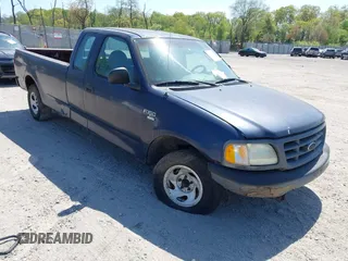 2003 Ford F-150 XL with VIN 1FTRX17W03NB84642, listed as a IAAI auction lot 42141979 with 112,902 mi miles. Bid and sale history available at carsss.com. Image 1.