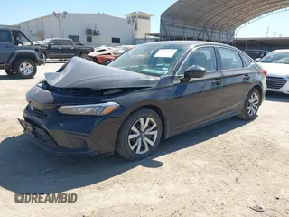 2022 Honda Civic LX z VIN 2HGFE2F20NH573453, wystawiony jako IAAI lot #41854126 z przebiegiem 34 289 mil mil oraz . Historia ofert i sprzedaży dostępna na DreamBid. Obrazek 17.