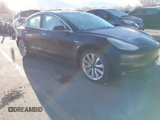 2019 Tesla Model 3 Long Range with VIN 5YJ3E1EBXKF392147, listed as a IAAI auction lot 41745460 with 133,745 mi miles. Bid and sale history available at carsss.com. Image 1.