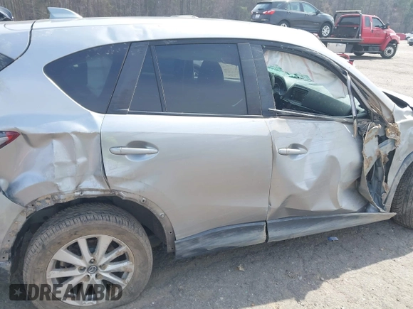 2015 Mazda CX-5 Touring with VIN JM3KE2CY6F0432910, listed as a IAAI auction lot 41784545 with 210,787 mi miles. Bid and sale history available at carsss.com. Image 18.