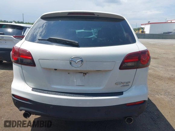 2014 Mazda CX-9 Touring z VIN JM3TB3CV7E0426900, wystawiony jako IAAI lot #42796725 z przebiegiem Nie podano mil oraz . Historia ofert i sprzedaży dostępna na DreamBid. Obrazek 16.